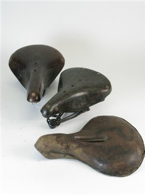 Lot 395 - Three Leather Saddles