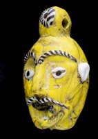 Lot 248 - Phoenician glass head pendant