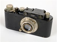 Lot 374 - Leica II rangefinder (1932) with 35mm, 50mm and 135mm lenses.