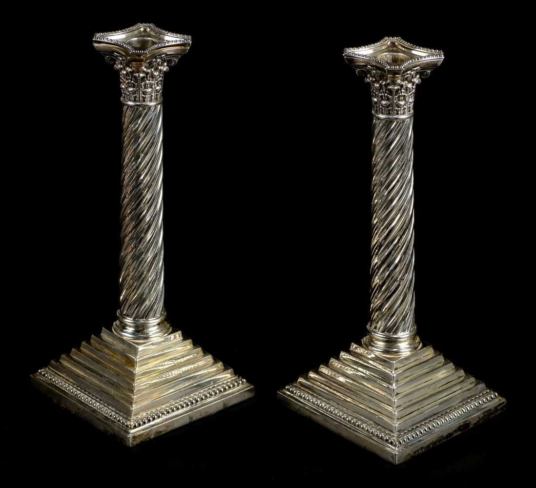 Lot 40 - Candlesticks. A pair of Victorian silver Corinthian column candlesticks by H.F., London, 1891