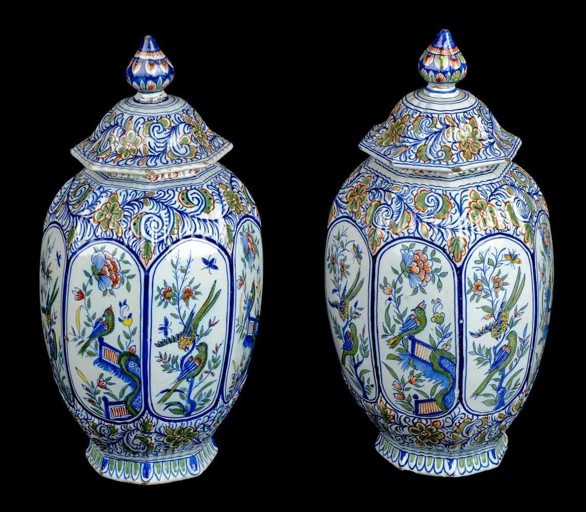 Lot 84 - Delft. A pair of late 19th century Dutch Delft octagonal pottery vase and covers