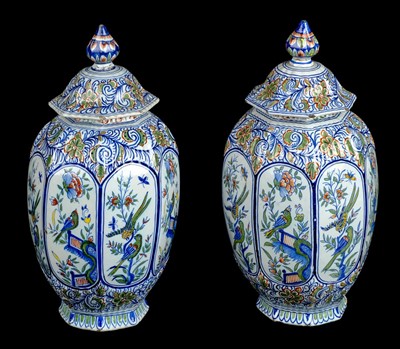 Lot 84 - Delft. A pair of late 19th century Dutch Delft octagonal pottery vase and covers