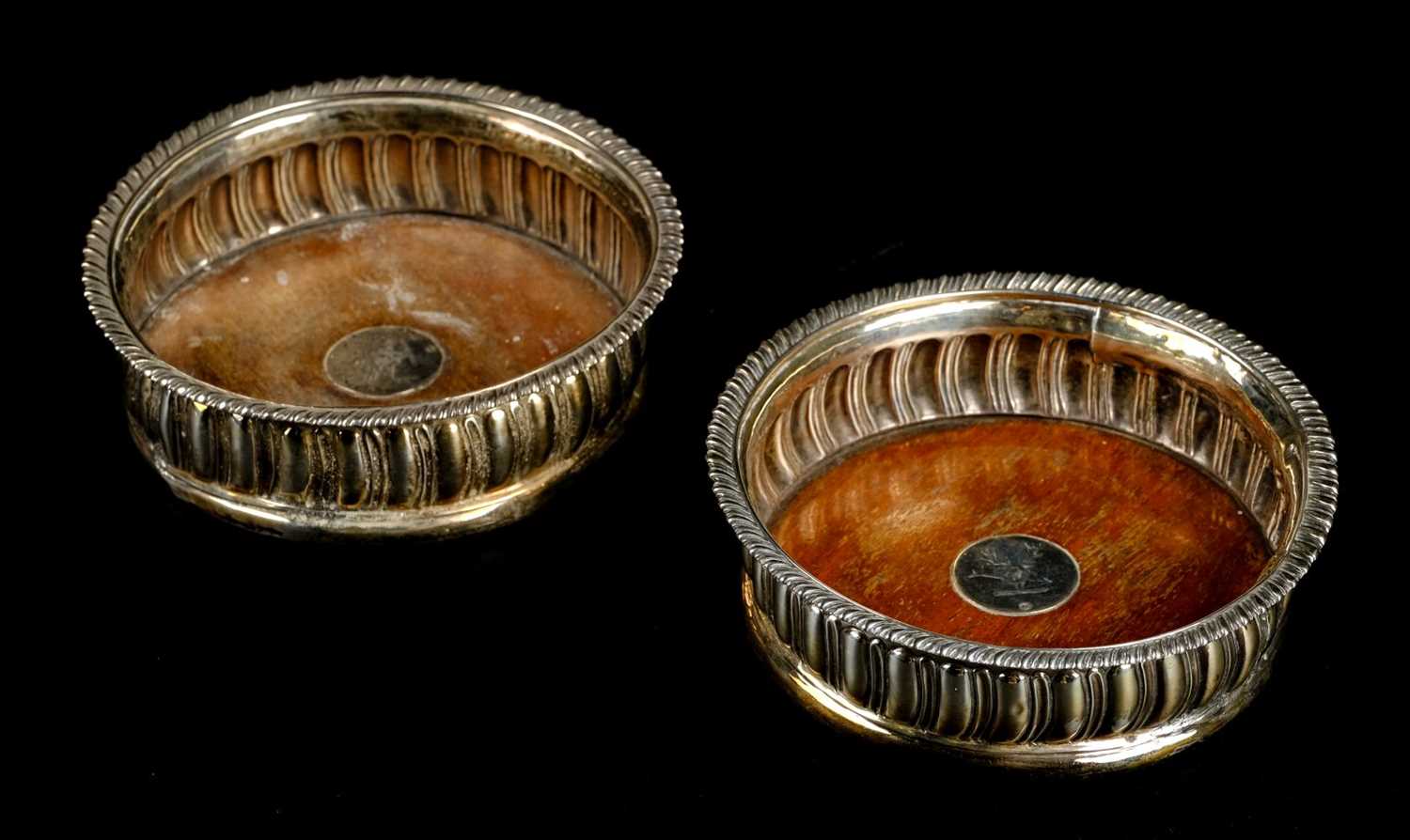 Lot 42 - Coasters. A pair of Georgian silver wine bottle coasters by Thomas Newby, London 1816