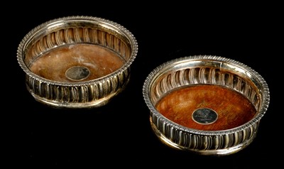 Lot 42 - Coasters. A pair of Georgian silver wine bottle coasters by Thomas Newby, London 1816