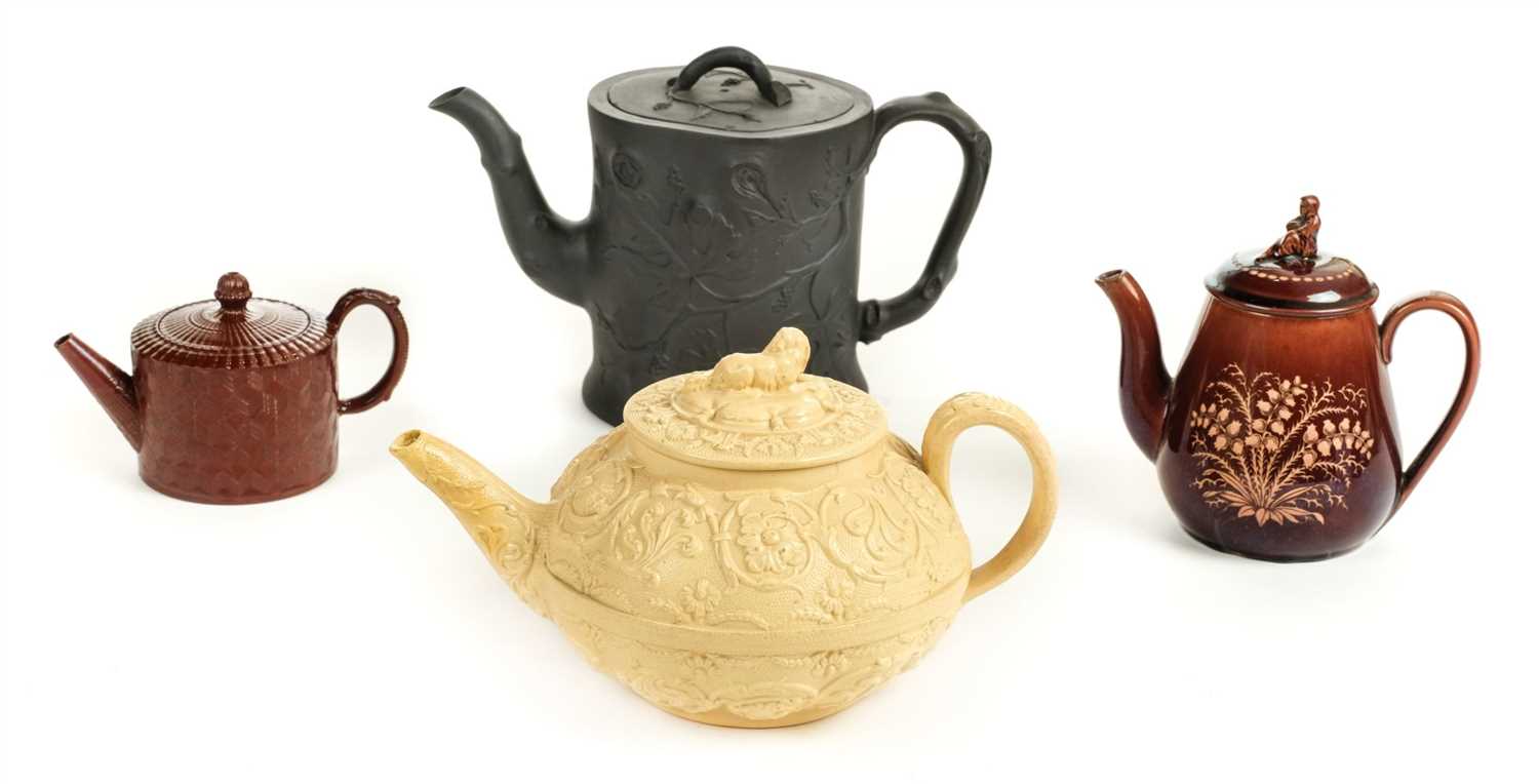 Lot 91 - Teapots. An early 19th century black basalt teapot, probably Spode