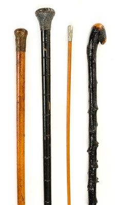 Lot 81 - Walking canes.  A 19th century Indian silver top cane