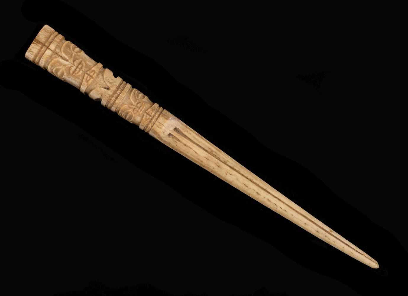 Lot 111 - Marquesas Islands. A French Polynesia carved bone fan handle