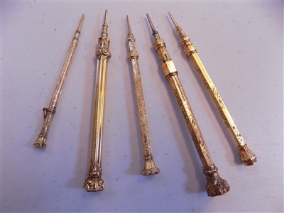 Lot 12 - Gold Pencils. A collection of 5 Victorian yellow metal propelling pencils