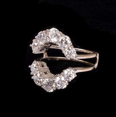 Lot 23 - Ring. An 18ct white gold jacket ring set with 10 brilliant cut diamonds