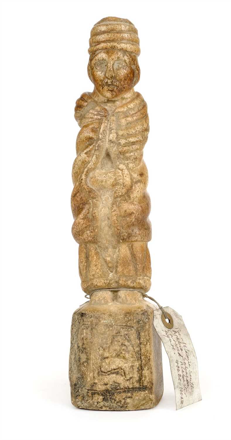 Lot 127 - Sabaean Figure. A carved Sabaean alabaster male figure 400BC-100AD