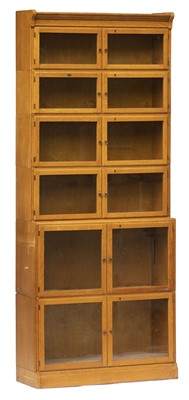 Lot 297 - Bookcase. A 1920s light oak 5-tier book case