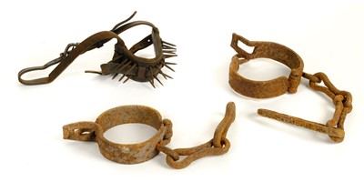 Lot 67 - Manacles. A pair of early 19th century harness-yoke iron manacles