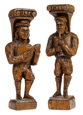 Lot 73 - Oak figures. A pair of carved oak figures playing musical instruments, late 19th/early 20th century