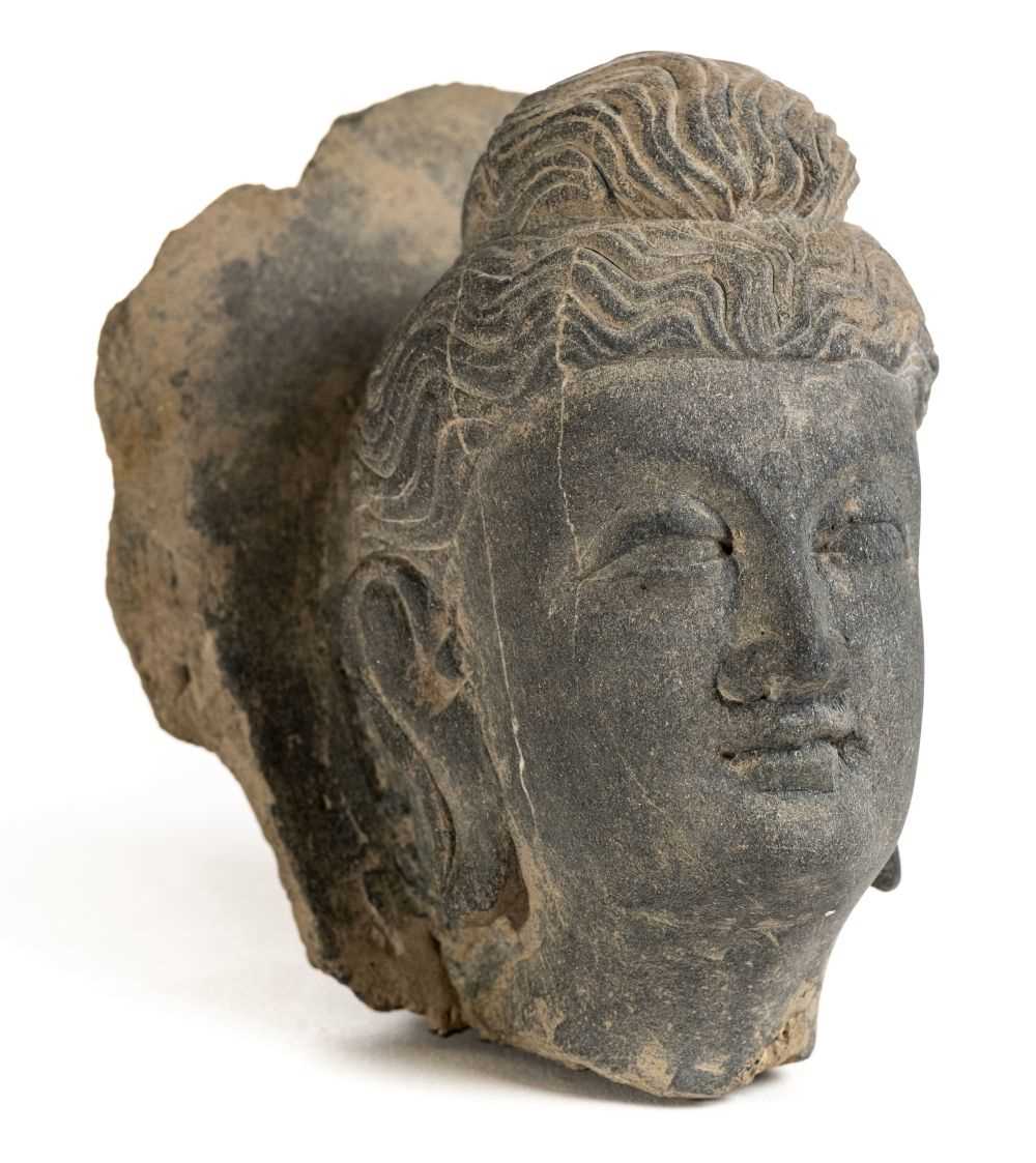 Lot 122 - Gandhara Carving. A large carved schist stone head of Bodhisattva