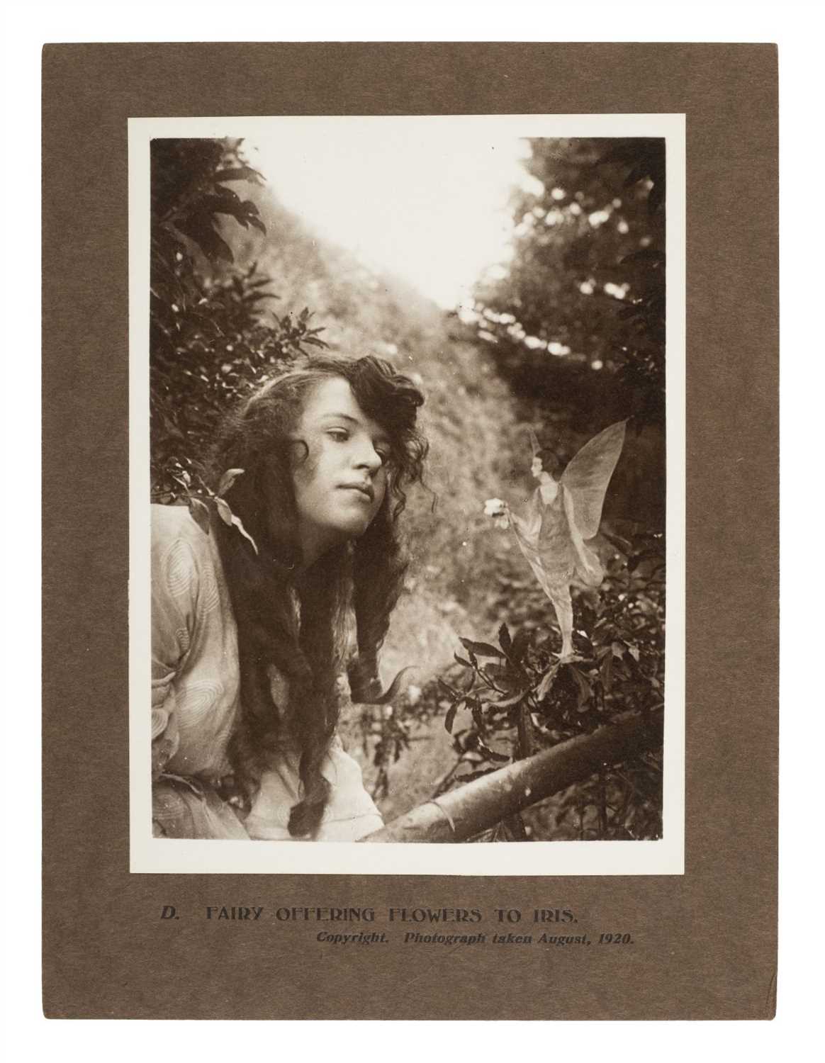 Lot 239 - Cottingley Fairies. Fairy offering flowers to Iris, 1920