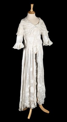 Lot 150 - Dress. An appliquéd white muslin overdress, circa 1910