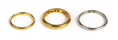 Lot 34 - Rings. Two 22ct gold wedding bands plus a platinum ring