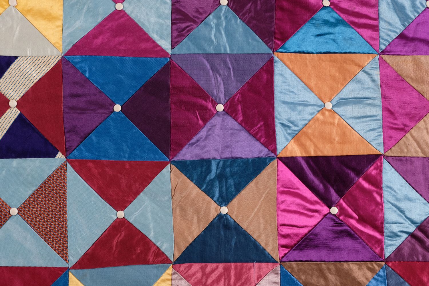 Lot 183 Quilt. A silk patchwork quilt, English,