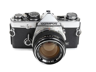 Lot 315 - Olympus OM2n 35mm SLR film camera with Zuiko 50mm f/1.4 prime lens and other lenses