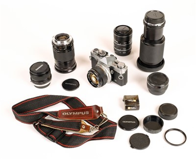 Lot 315 - Olympus OM2n 35mm SLR film camera with Zuiko 50mm f/1.4 prime lens and other lenses