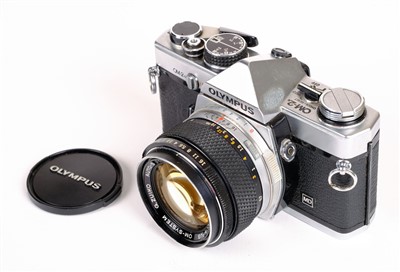 Lot 315 - Olympus OM2n 35mm SLR film camera with Zuiko 50mm f/1.4 prime lens and other lenses