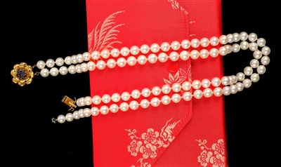 Lot 17 - Necklace. A Continental pearl necklace with 14K gold clasp