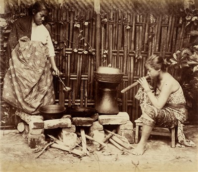 Lot 67 - Indonesia. Two Malay women cooking on bricks in a yard, c. 1870