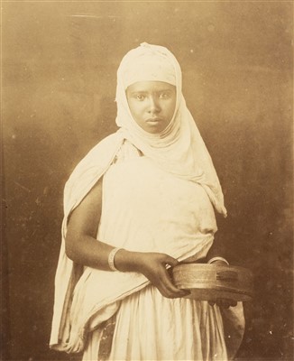 Lot 22 - North Africa. A portrait of a young North African woman holding a tambourine, c. 1880s