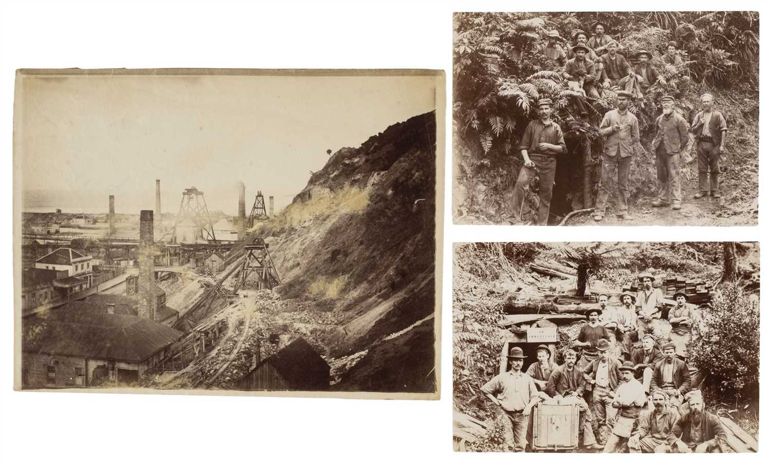 Lot 80 - New Zealand.  A pair of group portrait photographs of miners posing near mine entrances, 1890s