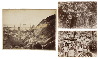 Lot 80 - New Zealand.  A pair of group portrait photographs of miners posing near mine entrances, 1890s