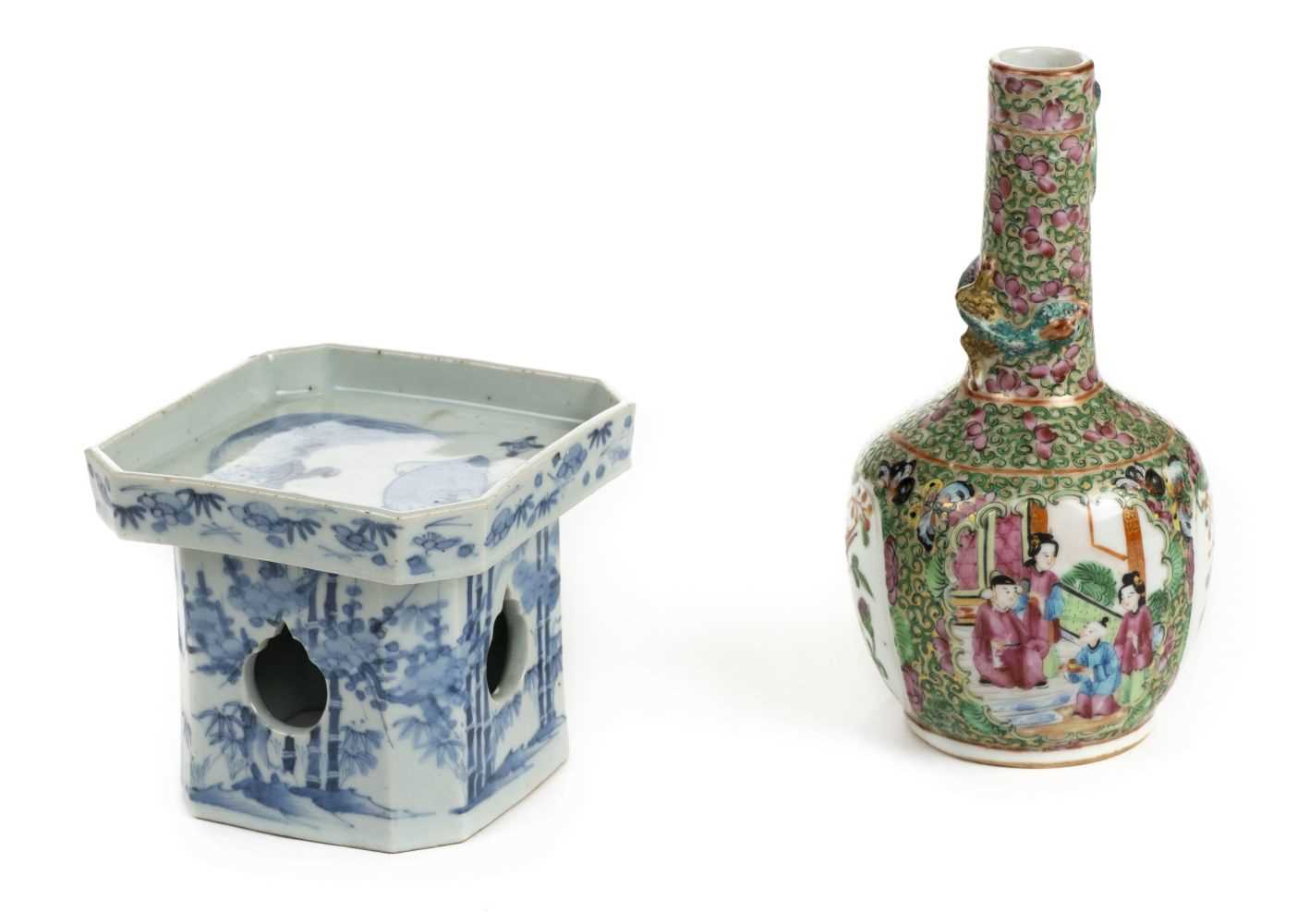 Lot 101 - Vase. A Chinese famille rose porcelain bottle vase plus blue and white stand