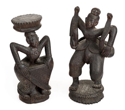 Lot 107 - Indonesia. A pair of Indonesian carved wood figures, early 20th century
