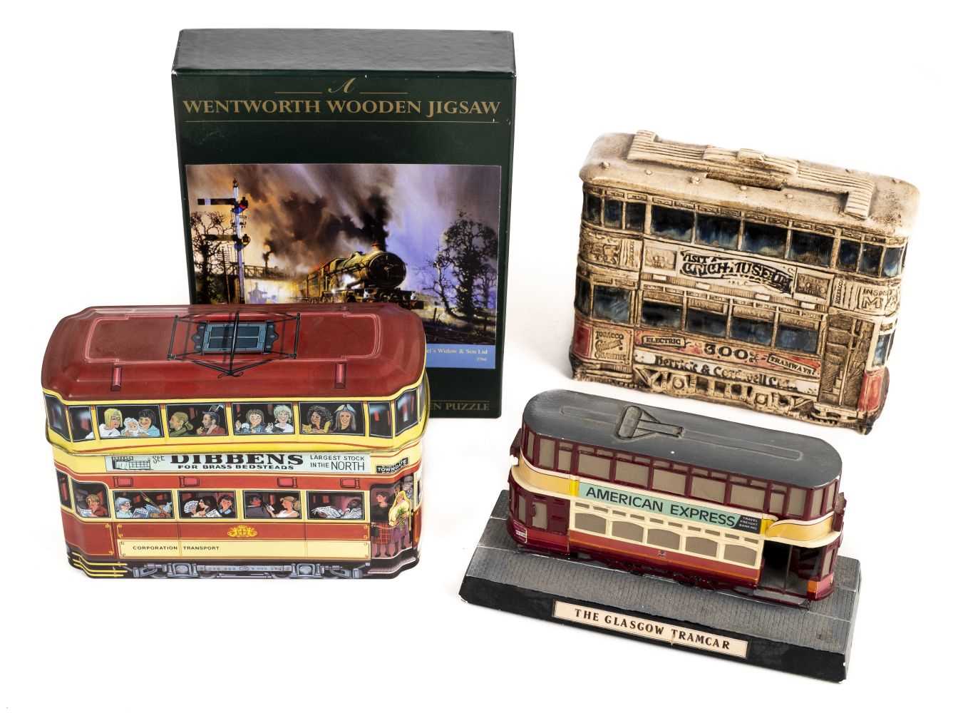 Lot 7 - Trams - Collectable tins. A collection of tram car form biscuit tins, money boxes and related