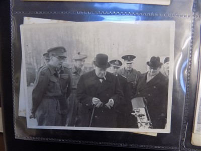 Lot 262 - WWII photographs. An album of WWII photographs including Churchill