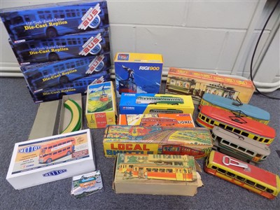 Lot 10 - Trams. A collection of toy trams and cars etc.