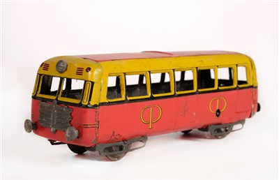 Lot 10 - Trams. A collection of toy trams and cars etc.