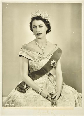 Lot 374 - Elizabeth II (Queen of Great Britain, born 1926). A three-quarter length portrait of the Queen