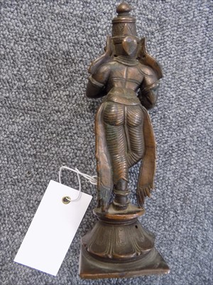Lot 102 - Indian bronzes. An Indian bronze of a seated deity