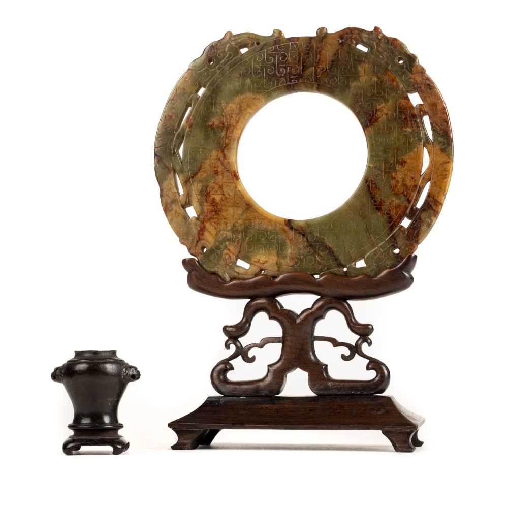 Lot 99 - Chinese soapstone. A 20th century Chinese soapstone Bi on stand