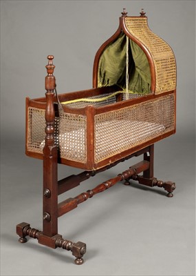 Lot 126 - Cradle. A Victorian mahogany and canework rocking cradle