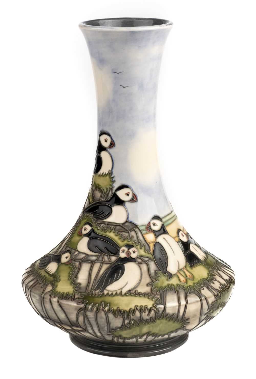 Lot 21 - Moorcroft. A Moorcroft pottery 'Puffin' pattern vase designed by Kerry Goodwin