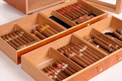 Lot 44 - Cigars. A fine collection of 143 Cuban cigars housed in 3 humidors