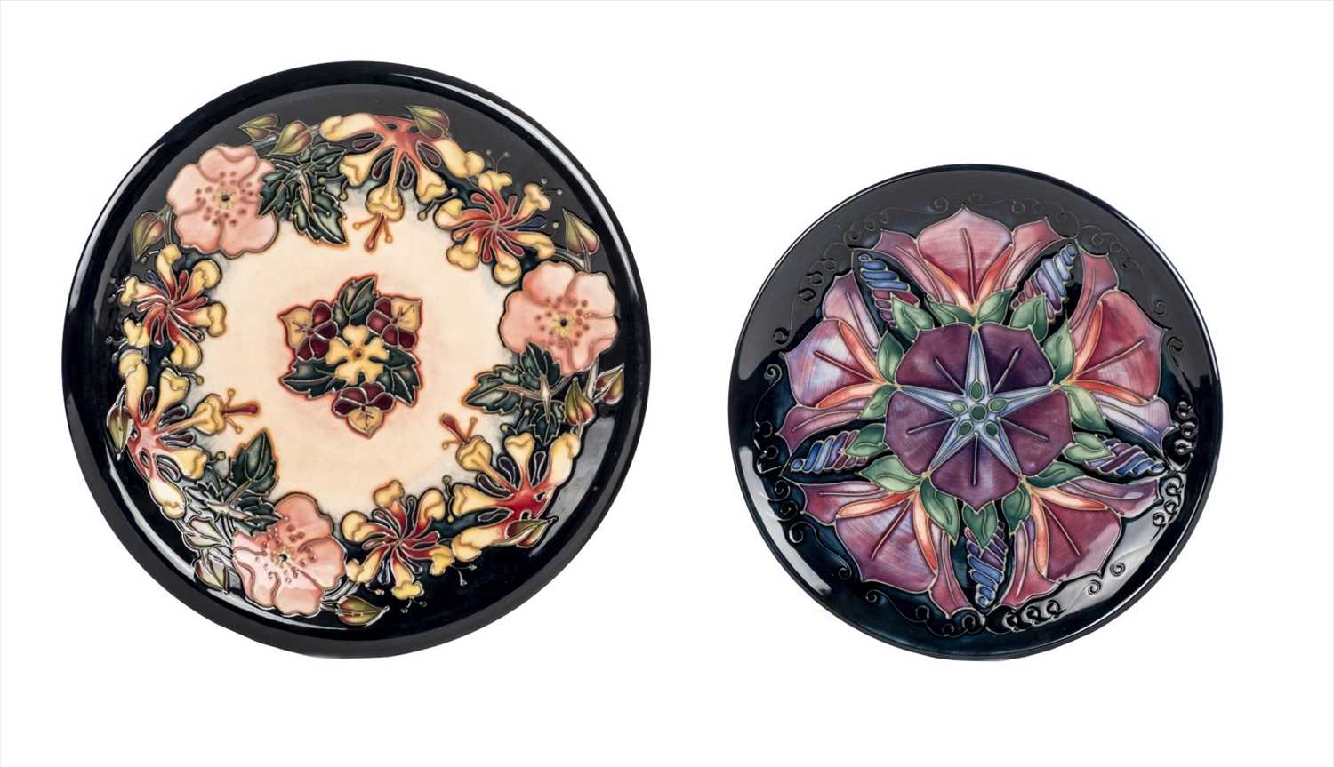 Lot 23 - Moorcroft. Two Moorcroft pottery floral decorated plates
