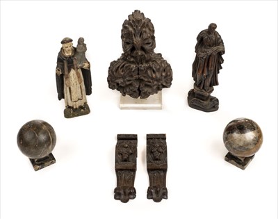 Lot 61 - Oak carvings. A carved oak pew end plus other items