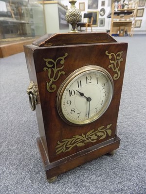 Lot 118 - Clock. A Regency style brass inlaid mahogany mantel clock