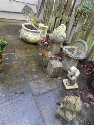 Lot 130 - Garden statuary. A pair of granite staddle stones plus other items