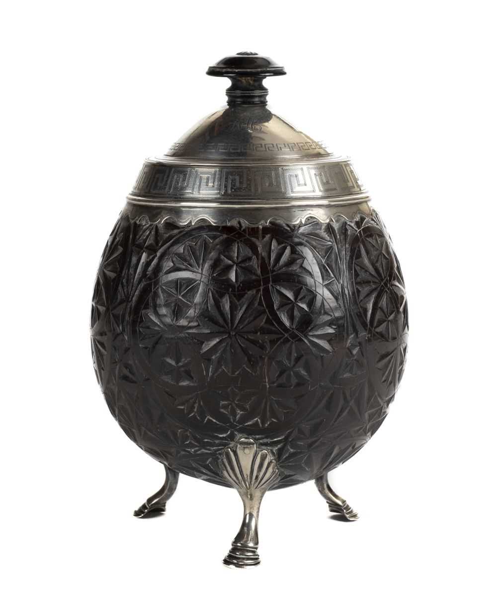 Lot 98 - Coconut cup. A George III silver-mounted coconut cup