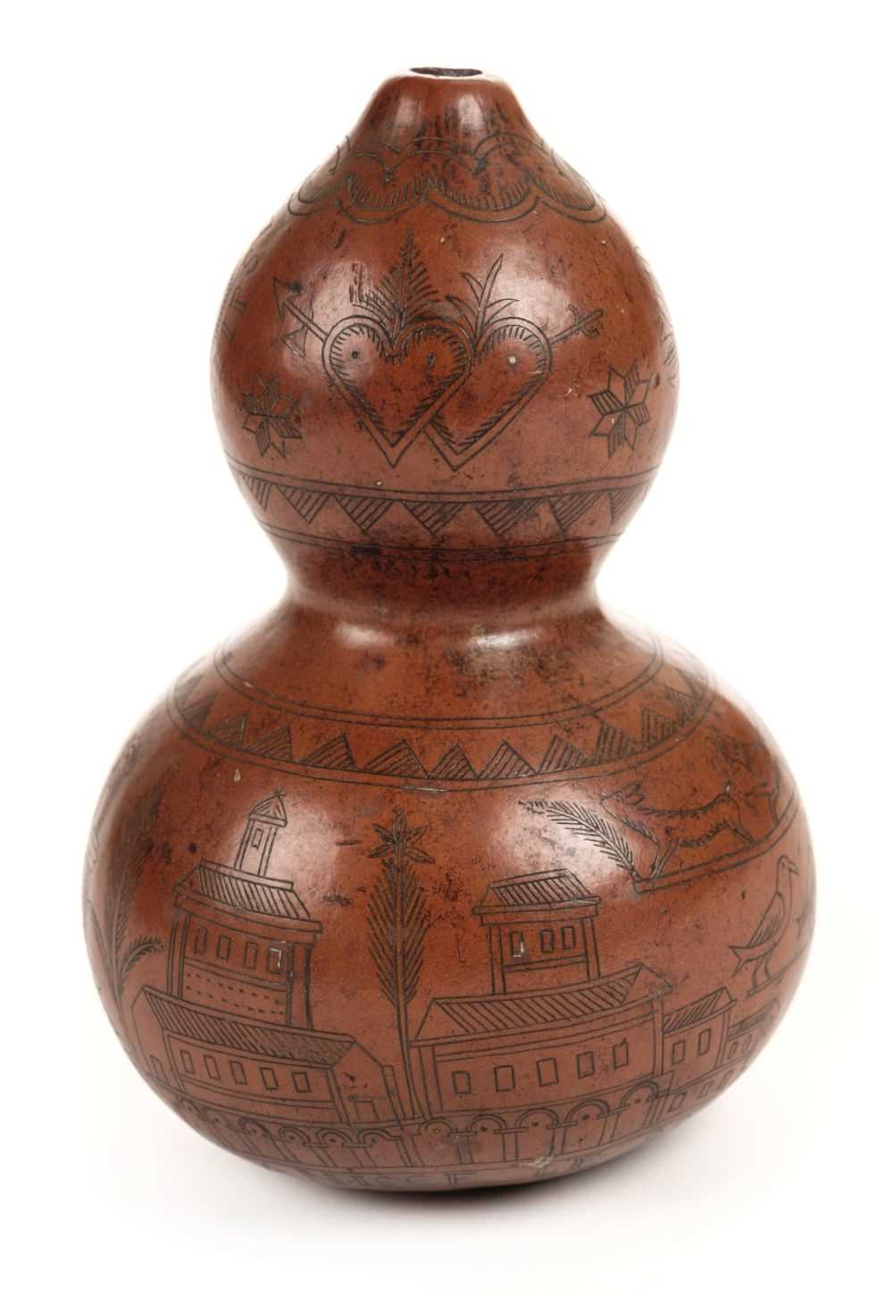 Lot 117 - Gourd. An early 19th century French double gourd with scrimshaw work