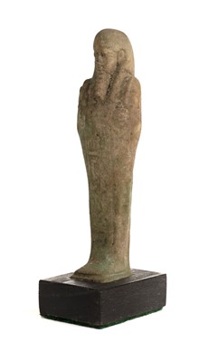 Lot 254 - Ancient Egypt. A 26th Dynasty, pale green faïence Shabti