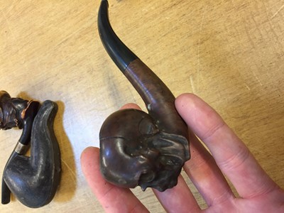 Lot 144 - Pipes. A collection of Victorian and later pipes including a skull pipe